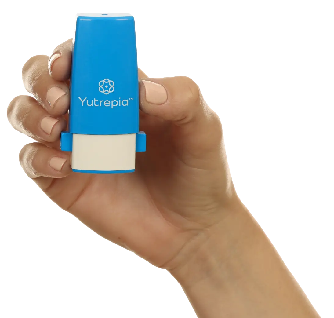 Photograph of hand holding YUTREPIA™ (treprostinil) inhalation powder device